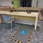 Fotografía de los Lugares reservados en el auditorio para las personas usuarias de silla de ruedas